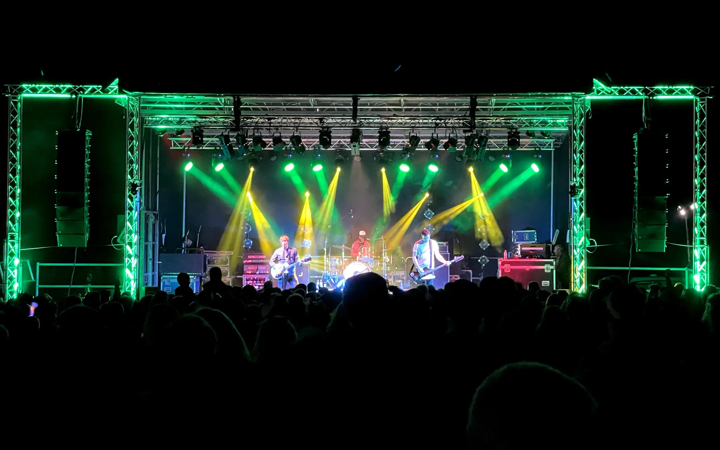 Festival crowd in front of a lit stage